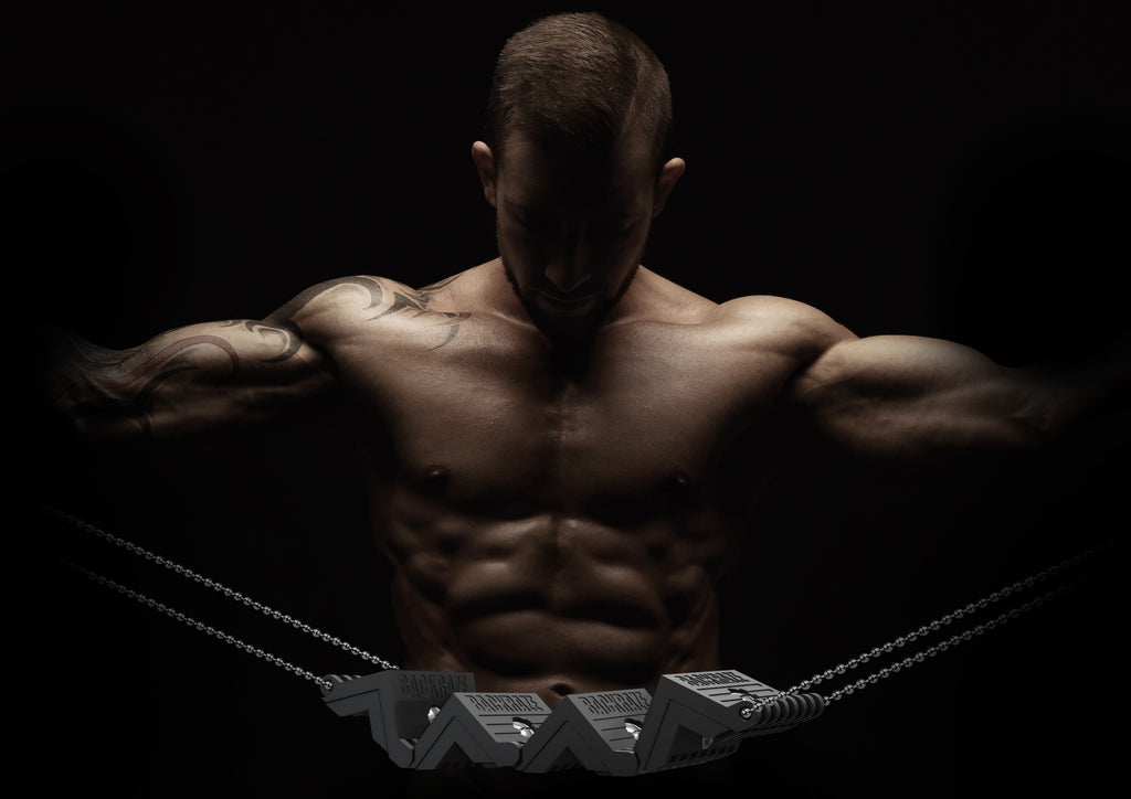Muscular man without top on showing off the backraze in a convex position 